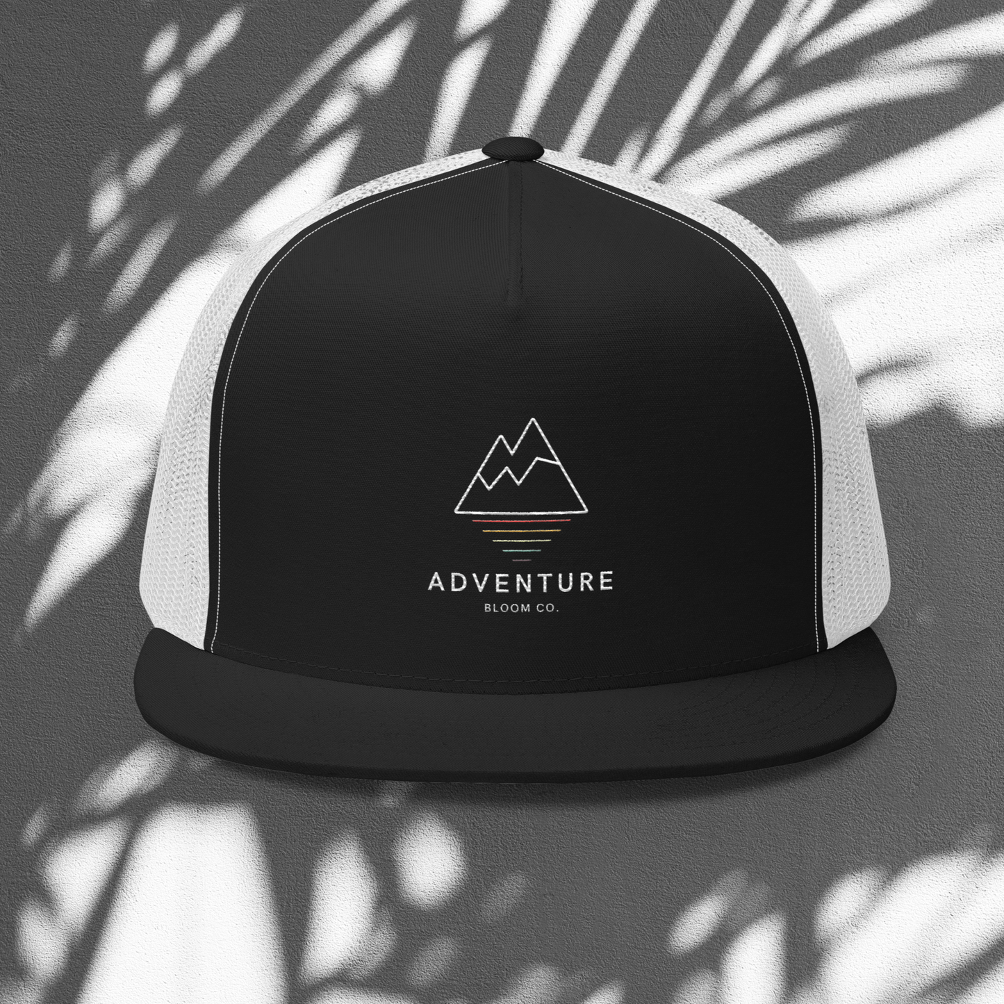 Summit Seeker Trucker Cap in Black and White: Elevate Your Adventure Style.