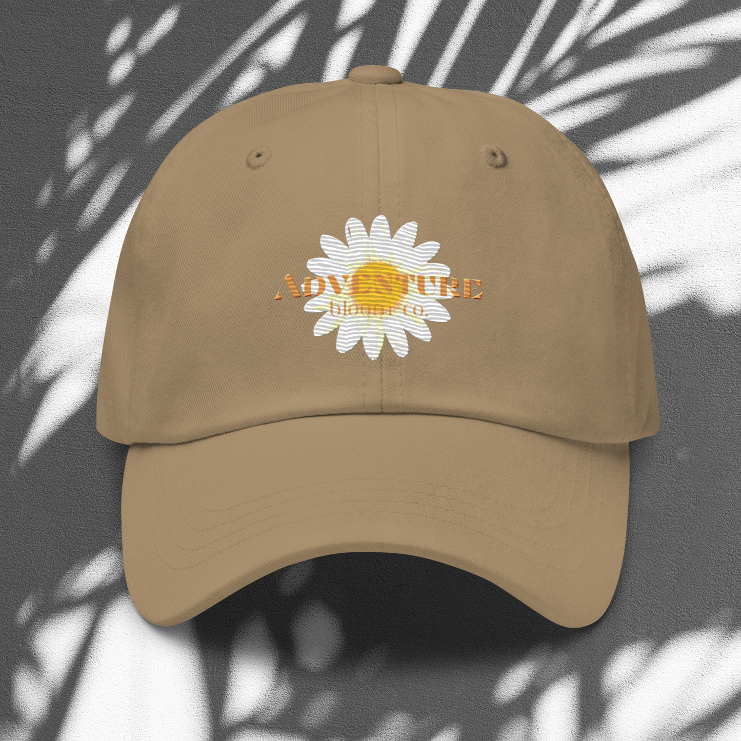 A close-up view of the Wild Bloom Baseball Cap in Khaki by Adventure Bloom Co.