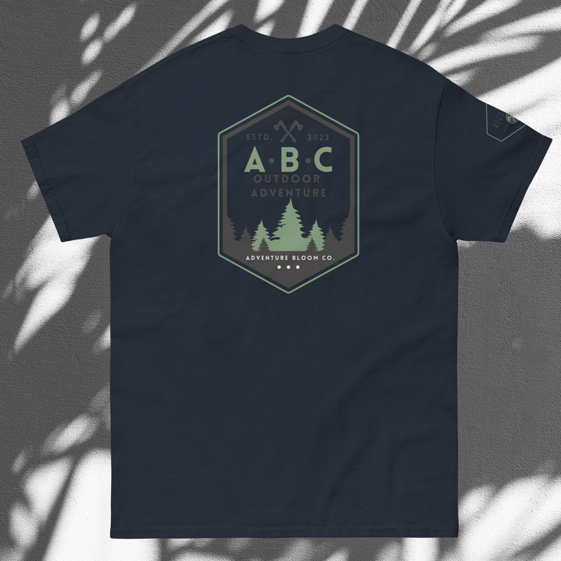 Lay Flat View of Adventure Bloom Co. Axe-Masters Adventure Tee in Navy