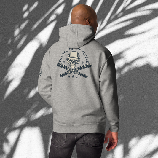 Ski enthusiast embracing the thrill of Adventure Bloom Co.'s hoodie design in Carbon Grey.