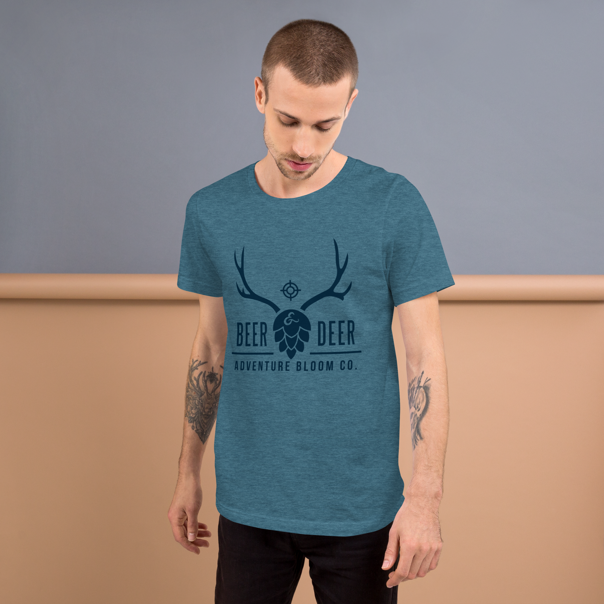 Relaxation after a successful hunt in Adventure Bloom Co.'s beer-themed tee in Heather Deep Teal.